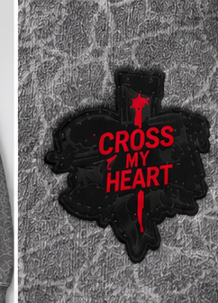 Cross My Heart black and red logo close up