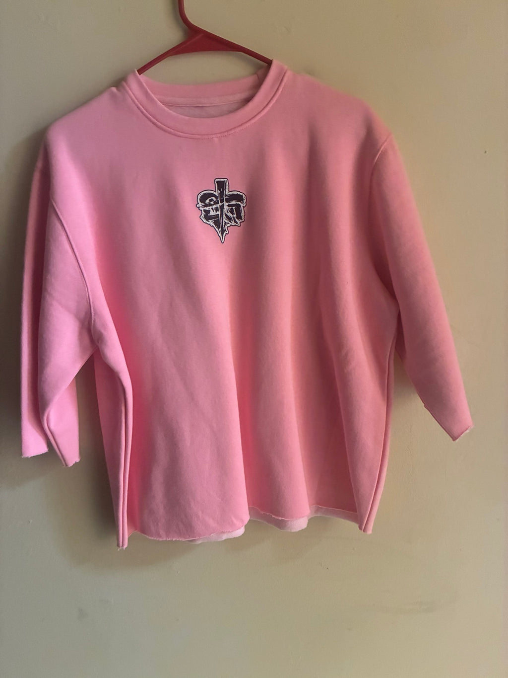 Cross My Heart pink oversized sweatshirt front