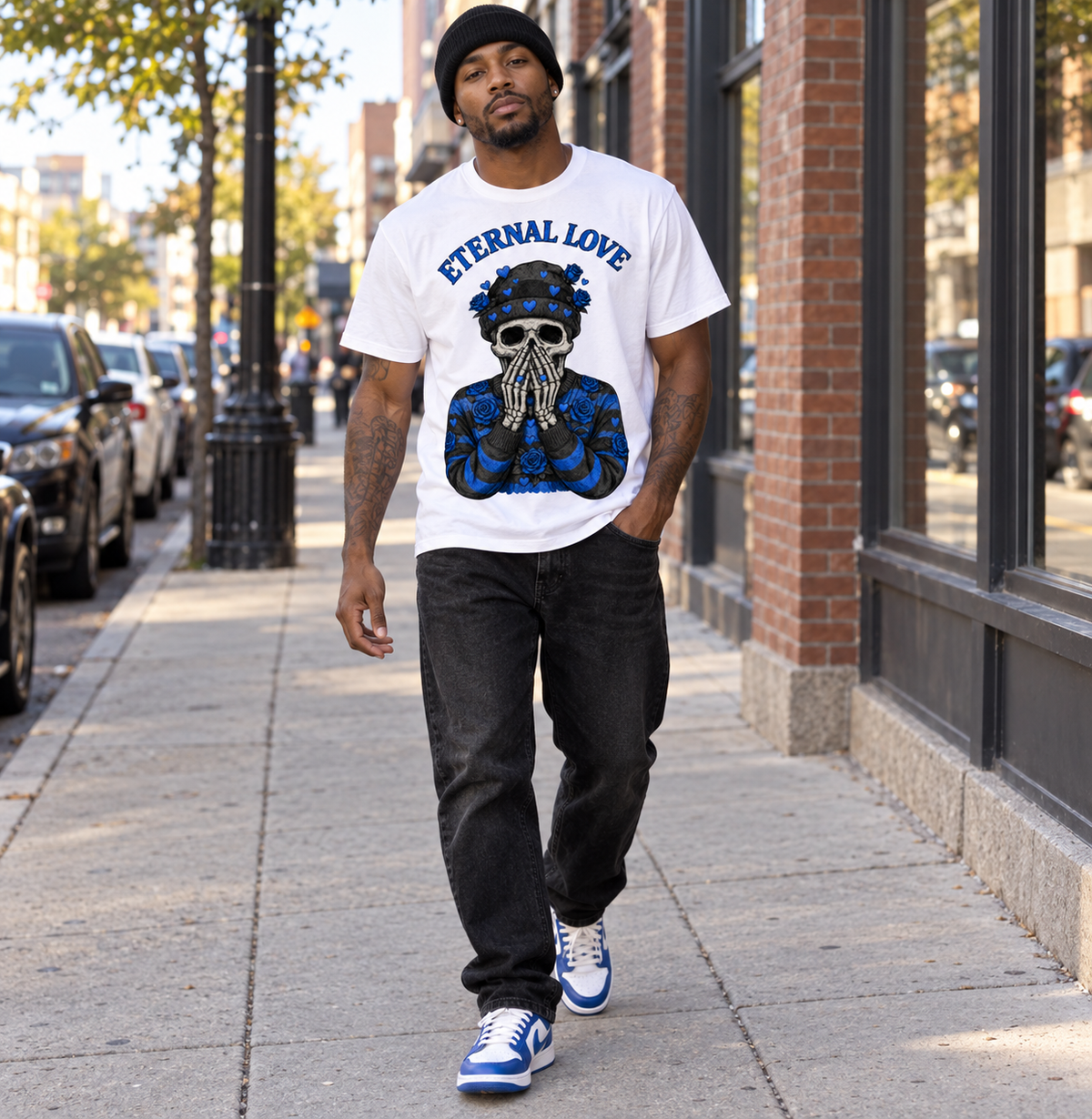 Male model walking outdoors in the white Eternal Love blue skull tee