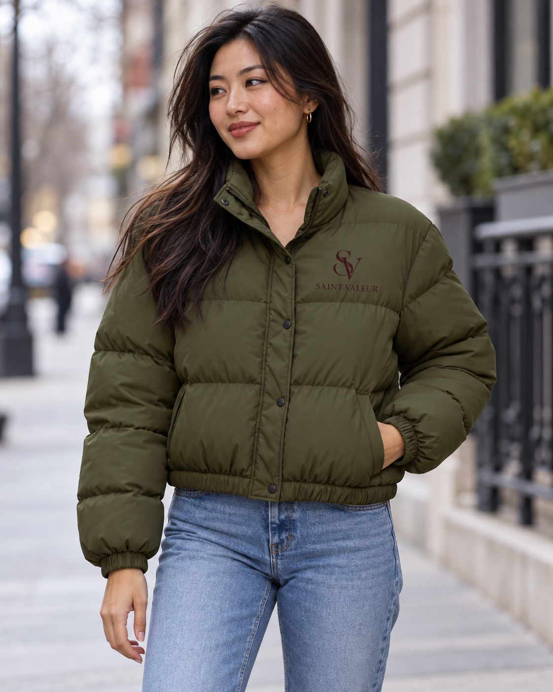 Model wearing olive Saint Valeur quilted puffer jacket with small burgundy SV left-chest logo