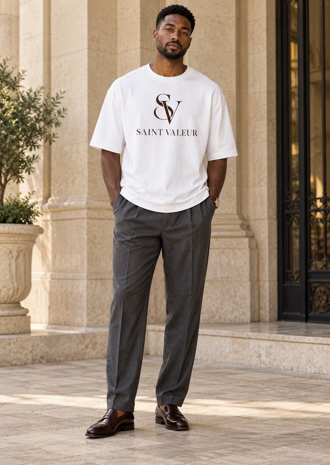 Saint Valeur white Supa Luxury Tee on model with gray slacks and brown dress shoes