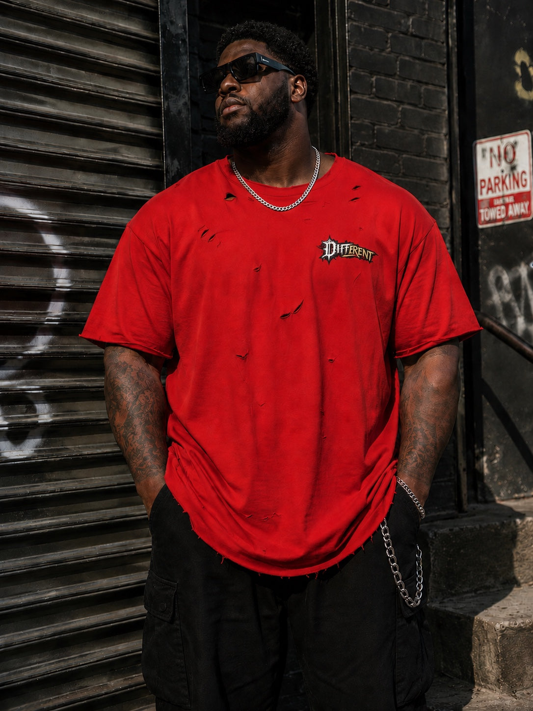 Man wearing the Unpopular Society distressed red tee