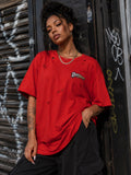 Woman wearing the Unpopular Society distressed red tee